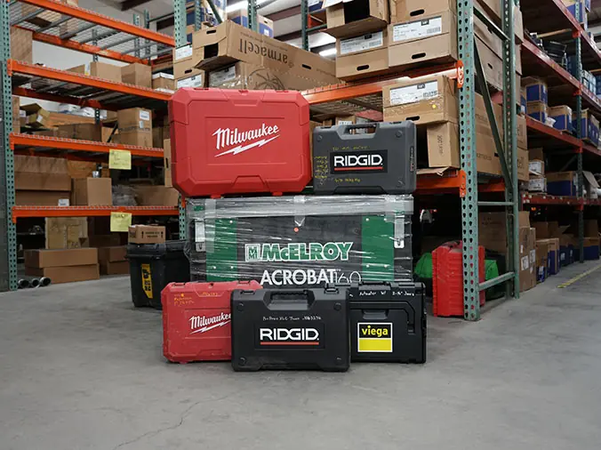 Tool boxes stacked in plumbing warehouse